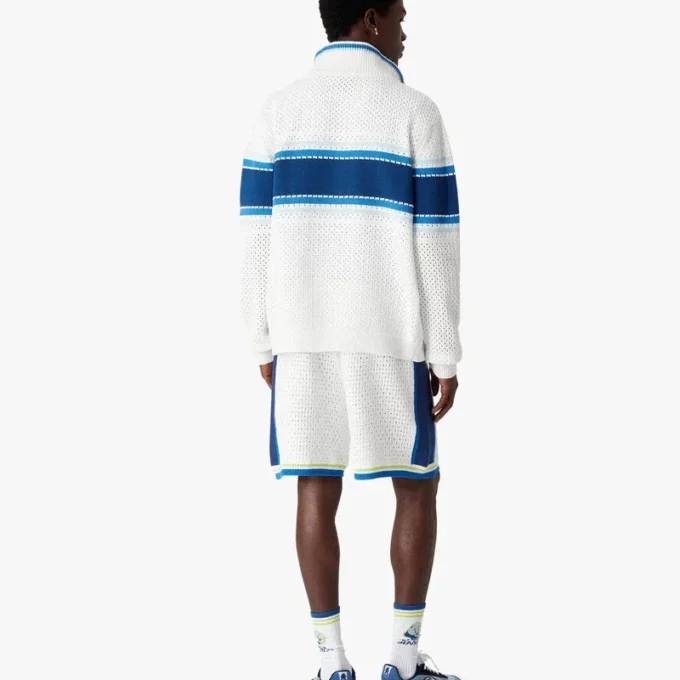 Veste de sport en maille rayée blanche et bleue