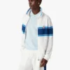Veste de sport en maille rayée blanche et bleue