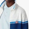 Veste de sport en maille rayée blanche et bleue
